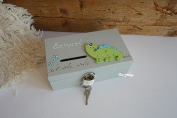 Dřevěná pokladnička s dinosaurem